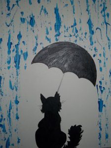 A-cat-sitting-under-an-umbrella