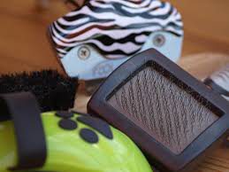 A slicker brush and a shedding brush